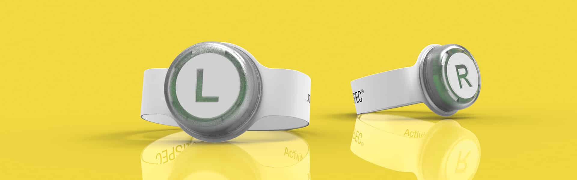 Two white wristbands with round discs, labeled "L" and "R," are displayed against a yellow background.