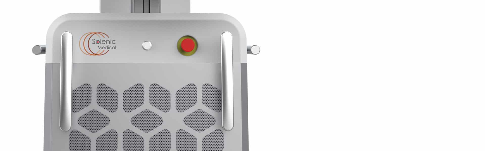 Close-up of a medical device with a gray panel, a red emergency button, and a logo reading "Selenic Medical". The panel features a honeycomb pattern and two metallic handles on the sides.