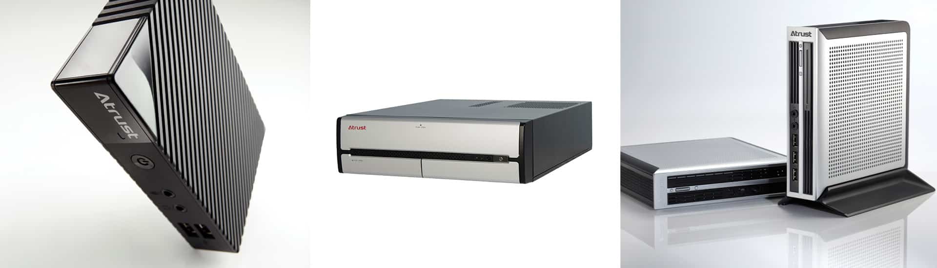 Three small-form-factor computers are shown in various perspectives; one angled view, one front view, and two units with one standing upright and the other lying flat.