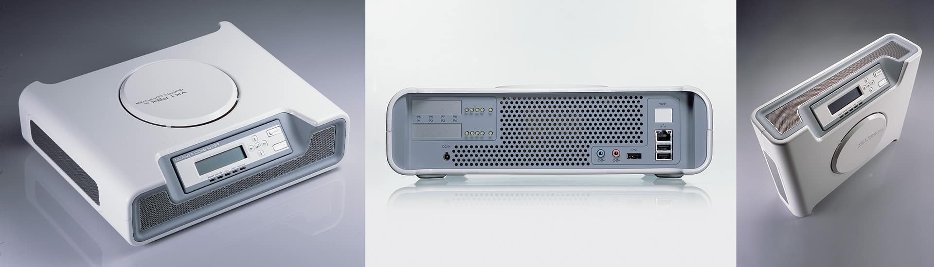 Three views of a white electronic device with a display screen, various ports, and buttons. Front, back, and perspective images are shown, highlighting its slim, rectangular design.